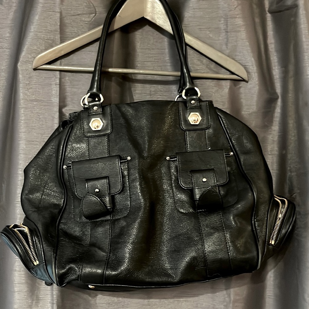 Like new Maxx New York Leather Purse. Comes with dust bag.